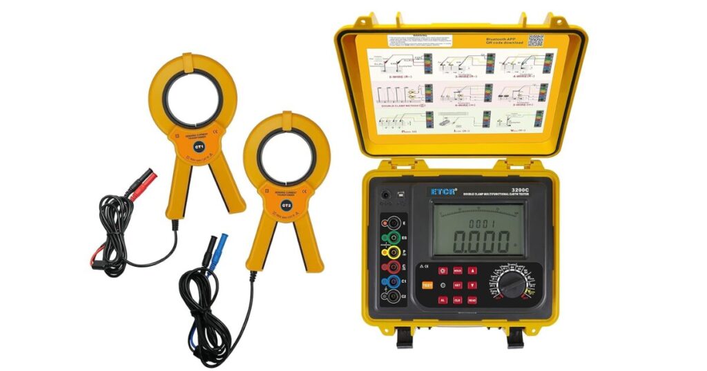 An ETCR 3200C double clamp earth ground tester in its yellow case with two sensing current transformer clamps and leads alongside